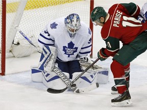 Toronto Maple Leafs goalie James Reimer, left, stops a shot by Minnesota Wild's Zach Parise during the third period of an NHL hockey game Thursday, Dec. 3, 2015, in St. Paul, Minn. The Wild won 1-0.