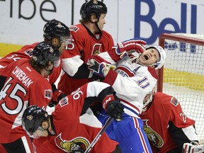 The Canadiens' Brendan Gallagher reacts as the Senators' Zack Smith (15) is called for a roughing penalty during NHL pre-season  game in Ottawa on Oct. 3, 2015.