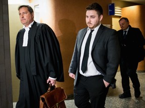 Felix Bérard, right, heads out of a courtroom with his lawyer, Frank Pappas, left, at the Montreal Courthouse on Tuesday, Jan. 26, 2016.