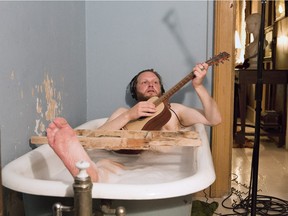 In the video installation titled The Visitors, Ragnar Kjartansson is seen soaking in a bathtub, in a house full of musicians playing in separate rooms. His work is on display Feb. 11 through to May 22 at the Musée d'art contemporain de Montréal.
