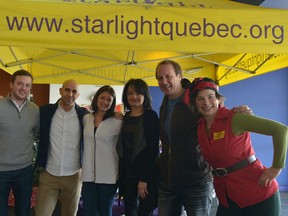 Brian Bringolf, executive director of Starlight Children's Foundation Canada, second from right, joined by Ardene staff and a festive friend in red at the Starlight Children's Foundation Canada holiday party held Dec. 20 at the Cineplex Odeon Brossard and VIP Cinemas.