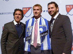 Clemson defender Kyle Fisher went 14th to the Montreal Impact in the MLS SuperDraft in Baltimore on Thursday, Jan. 14, 2016. coach Mauro Biello is at left and technical director Adam Braz is at right.