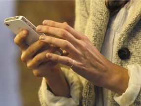 A woman uses her smartphone.