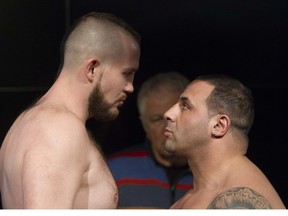 Eric " Boom" Barrak looks up to Canadian heavyweight champ Dillon Carman at a weigh-in in Montreal Wednesday, January 20, 2016. This was in advance of the first boxing card to be held at the Casino in a little more than 3 years. The pair are scheduled for a 10-round heavyweight fight.