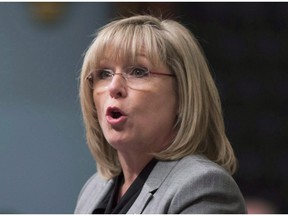 Francine Charbonneau, minister responsible for seniors and anti-bullying, defended her decision to not make denunciations of elder abuse mandatory Tuesday.