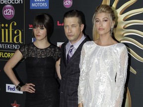 Stephen Baldwin and his daughters Alaia, left, and Hailey put on their happy faces in 2014.