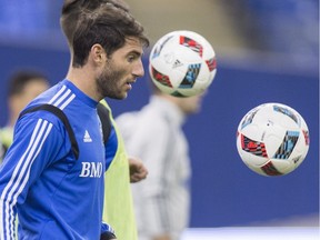Montreal Impact midfielder Ignacio Piatti handles a ball during first day of training camp, Monday, Jan. 25, 2016. in Montreal.