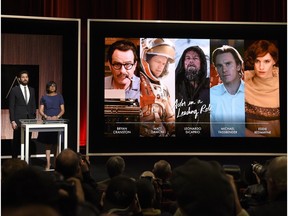 John Krasinski, left, and Academy president Cheryl Boone Isaacs announce the Academy Awards nominations for best performance by an actor in a leading role at the 88th Academy Awards nomination ceremony in Beverly Hills, Calif., on Jan. 14, 2016.