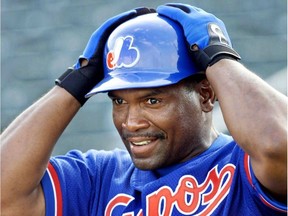 Tim Raines adjusts his helmet during spring training in 2001 at Jupiter, Fla.