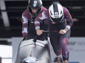 Kaillie Humphries and Melissa Lotholz of Canada race during the first run of women's bobsled at the IBSF World Cup in Whistler, B.C., Saturday, Jan. 23, 2016.