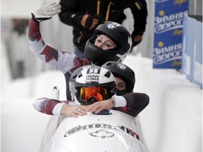 Driver Kaillie Humphries with Cynthia Appiah, Geneviève Thibault and brakeman Melissa Lotholz, of Canada, finish their second run in the four-person bobsled World Cup race on Saturday, Jan. 9, 2016, in Lake Placid, N.Y. They became the first all-female team to compete in a four-person World Cup bobsled race at Mount Van Hoevenberg.