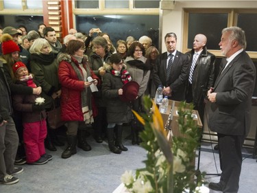 Quebec Premier Philippe Couillard speaks at a vigil held in Lac Beauport Monday, January 18 for the victims of a terror killing in Burkina Faso that included Lac Beaufort residents Yves Carrier, Gladys Chamberland and their children Maude and Charlelie Carrier.