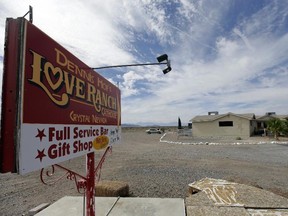 In this Oct. 14, 2015, file photo, a sign advertises the Love Ranch brothel in Crystal, Nev., where former NBA basketball player Lamar Odom was found unconscious the day before, after four days at the brothel.