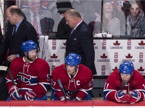 Canadiens head coach Michel Therrien leaves the bench past players, from left, David Desharnais, Max Pacioretty and Brendan Gallagher following their 3-1 loss to the Pittsburgh Penguins in NHL hockey action Saturday, January 9, 2016 in Montreal.