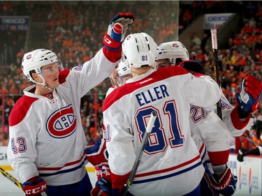 Alex Galchenyuk #27 of the Montreal Canadiens is congratulated by teammates Daniel Carr #43, Lars Eller #81 and Mark Barberio #45 after Galchenyuk scored in the first period against the Philadelphia Flyers at the Wells Fargo Center on January 5, 2016 in Philadelphia, Pennsylvania.