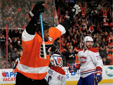 Wayne Simmonds of the Philadelphia celebrates his goal in the second period as Canadiens goalie Ben Scrivens and defenceman Andrei Markov  look on at the Wells Fargo Center on January 5, 2016 in Philadelphia.