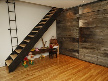 A barn wood covers the wall next to the staircase that does not lead to anywhere.  (Marie-France Coallier / MONTREAL GAZETTE)