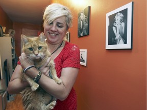 Myriam Rochet with cat Daisyfée in her Verdun flat. (John Mahoney / MONTREAL GAZETTE)