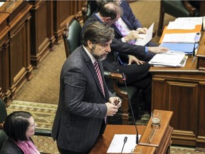 Projet Montreal leader Luc Ferrandez asks a question during a city council meeting at city hall in Montreal on Monday, Dec. 14, 2015.