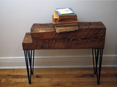 Francois Xavier Saint Georges and his wife Agnes Dupuis  started their own business - By the North - which repurposes old wood into furniture like this small shelve. (Marie-France Coallier / MONTREAL GAZETTE)