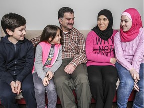 Alfadel Mofti and wife Bushra Meek with their children Mohammad, Ghina and Nour at their apartment in St-Polycarpe, west of Montreal on Monday December 28, 2015.  The family are Syrian refugees who have been in Canada since October.  (John Mahoney / MONTREAL GAZETTE)
