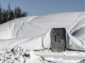 MONTREAL, QUE.: January 05, 2016 -- The entrance is all that's left standing of a portion of the sports dome that has deflated in Baie D'Uurfe, west of Montreal Tuesday January 05, 2016.  Two substantial rips occurred during regular snow removal operations December 31.  The rips have forced the closure of the dome which is privately owned. (John Mahoney / MONTREAL GAZETTE)