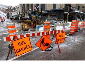 MONTREAL, QUE.: JANUARY 1, 2016 -- A water leak appeared at the intersection of Peel and Sainte-Catherine Streets in Montreal, on Friday, January 1, 2016 but  it will have to wait as the one available service crew was busy with another leak on Peel Street just north of Sherbrooke Street, seen here. (Dave Sidaway / MONTREAL GAZETTE)