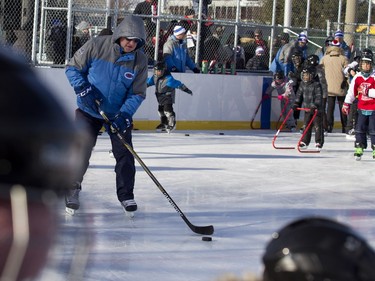 Montreal Canadiens head coach Michel Therrien takes a shot on net in Parc Emile in Laval on Monday, Jan. 11, 2016. The Canadiens practiced on the new Montreal Canadiens Foundation Blue Blanc Rouge rink in the park after the opening ceremony.