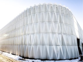 The most noticeable architectural feature of new the Ericsson plant in Vaudreuil-Dorion is a corrugated wall that surrounds the actual buildings.  One of the wall's functions is to bounce noise back towards the buildings within its perimeter.  Wall appearing opaque from the exterior, the wall is quite transparent from within.  (John Mahoney / MONTREAL GAZETTE)