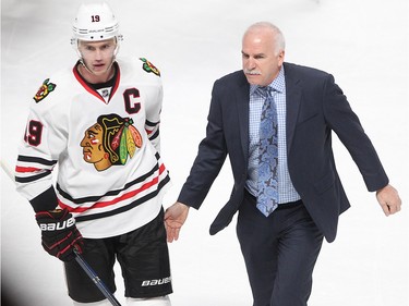 Chicago Blackhawks head coach Joel Quenneville walks off the ice with Chicago Blackhawks centre Jonathan Toews following win over the Montreal Canadiens in NHL action in Montreal on Thursday January 14, 2016.
