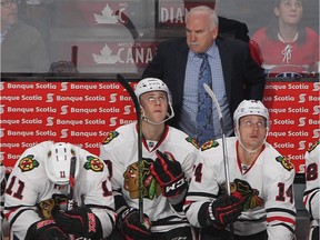 Blackhawks head coach Joel Quenneville looks at his players during first period NHL action in Montreal on Thursday January 14, 2016.