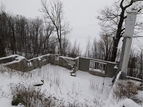 Only the skeleton remains of the home at 664 Main Rd in Hudson, on Saturday January 16, 2016. The owners of this property, where the house was destroyed by fire a few years ago, are fighting town hall for the right to rebuild on the lot. (Allen McInnis / MONTREAL GAZETTE)