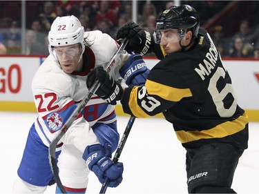 Boston Bruins Brad Marchand gets his stick on Montreal Canadiens Dale Weise during first period of National Hockey League game in Montreal Tuesday January 19, 2016.