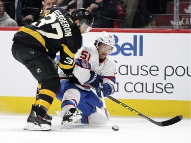 Montreal Canadiens David Desharnais passes the puck while being checked by Boston Bruins Patrice Bergeron during first period of National Hockey League game in Montreal Tuesday January 19, 2016.