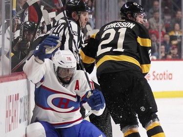 Montreal Canadiens P.K. Subban hits the boards after missing a check on Boston Bruins Loui Eriksson during second period of National Hockey League game in Montreal Tuesday January 19, 2016.