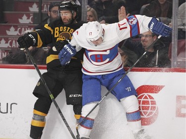 Montreal Canadiens Torrey Mitchell, right, and Boston Bruins Max Talbot collide during second period of National Hockey League game in Montreal Tuesday January 19, 2016.
