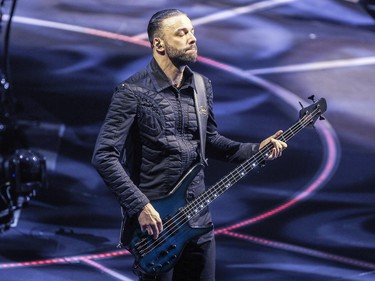 Muse bass player Chris Wolstenholme in concert at the Bell Centre in Montreal Wednesday January 20, 2016.