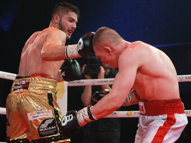 Erik Bazinyan, left, of Laval hits Michal Ludwiczak of Poland during boxing event at the Casino de Montréal, Thursday January 21, 2016.