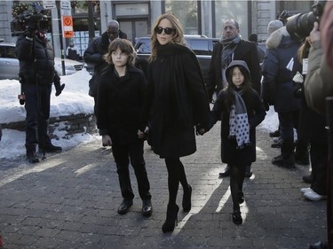 Julie Snyder arrives with son Thomas and one of her daughters, Romy, to pay their respects to René Angélil, pop star Céline Dion's husband and manager, Jan. 9, 2016 at Notre Dame Basilica in Montreal.