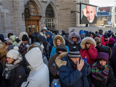 Members of the public line up to pay their respects to René Angélil, pop star Céline Dion's husband and manager, Thursday January 21, 2016 at the Notre Dame Basilica in Montreal. Angélil died of cancer January 14, 2016 and was lying in state Thursday before his funeral Friday.