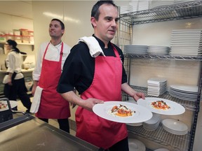 Renoir executive chef Olivier Perret readies plates during last year's fundraiser. The third edition of the event will take place Jan. 27.