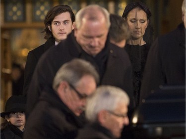Céline Dion and son René-Charles follow the casket out of Notre Dame Basilica at the funeral for René Angélil, in Montreal, Friday January 22, 2016.