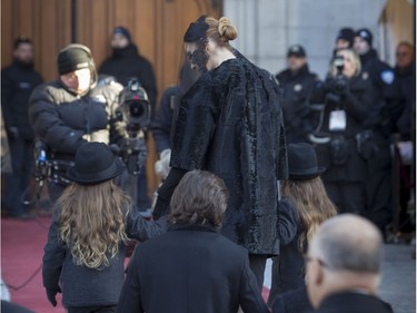 Céline Dion makes her way toward the basilica with her 3 sons Nelson, Eddy and René-Charles for the funeral of husband René Angélil at the Notre Dame Basilica in  Montreal, Friday January 22, 2016.