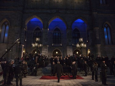 Céline Dion with her sons  René-Charles, to her right and twins Nelson and Eddy, along with more family, stand before the casket after the funeral for husband and father,  René Angélil, at Notre Dame Basilica, in Montreal, Friday January 22, 2016.