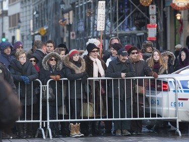 Fans crowded outside the Notre Dame Basilica at the funeral for René Angélil, in Montreal, Friday January 22, 2016.