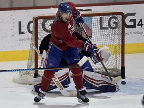 Canadiens right wing Dale Weise tips the puck past Montreal Canadiens goalie Ben Scrivens during a team practice at the Bell Sports Complex in Montreal on Friday January 22, 2016.