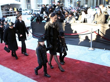 Singer Céline Dion, middle, walks with her twin sons, Nelson and Eddy, followed by her older son, René-Charles and her mother, Thérèse Dion, far left, at the entrance of Montreal's Notre Dame Basilica on Friday January 22, 2016.