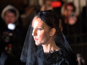 Singer Céline Dion walks out of Montreal Notre-Dame Basilica  after her husband's funeral on Jan. 22, 2016.