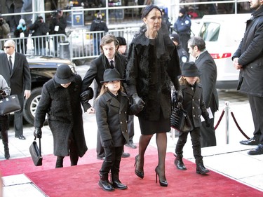Singer Céline Dion walks with her twin sons, Nelson and Eddy, followed by her older son, René-Charles and her mother, far left, at the entrance of Montreal's Notre Dame Basilica on Friday January 22, 2016. René Angélil, leaves his wife Céline Dion, their three boys, and his three adult children from his first two marriages, Patrick, Jean-Pierre and Anne-Marie.