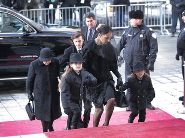 Singer Céline Dion walks with her twin sons, Nelson and Eddy, followed by her older son, René-Charles and her mother, far left, at the entrance of Montreal's Notre Dame Basilica on Friday January 22, 2016. René Angélil, leaves his wife Céline Dion, their three boys, and his three adult children from his first two marriages, Patrick, Jean-Pierre and Anne-Marie.
